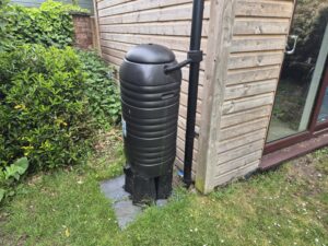 Slimline water butt in UK garden. One of the best water butts when space is limited or multiple are wanted.