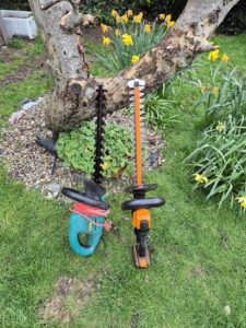 Corded vs cordless hedge trimmers side by side Bosch corded and Worx cordless comparison