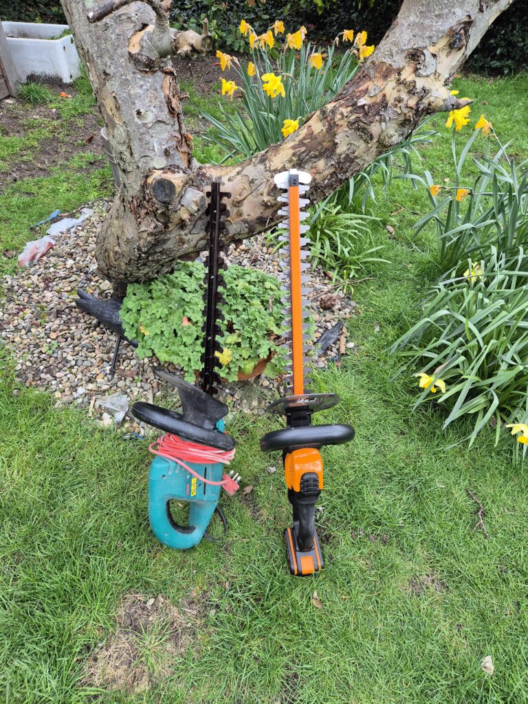 Corded vs cordless hedge trimmers side by side Bosch corded and Worx cordless comparison
