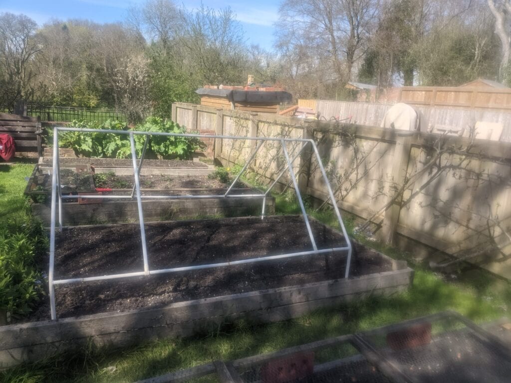 mini greenhouse frame assembled ready for cover in UK garden