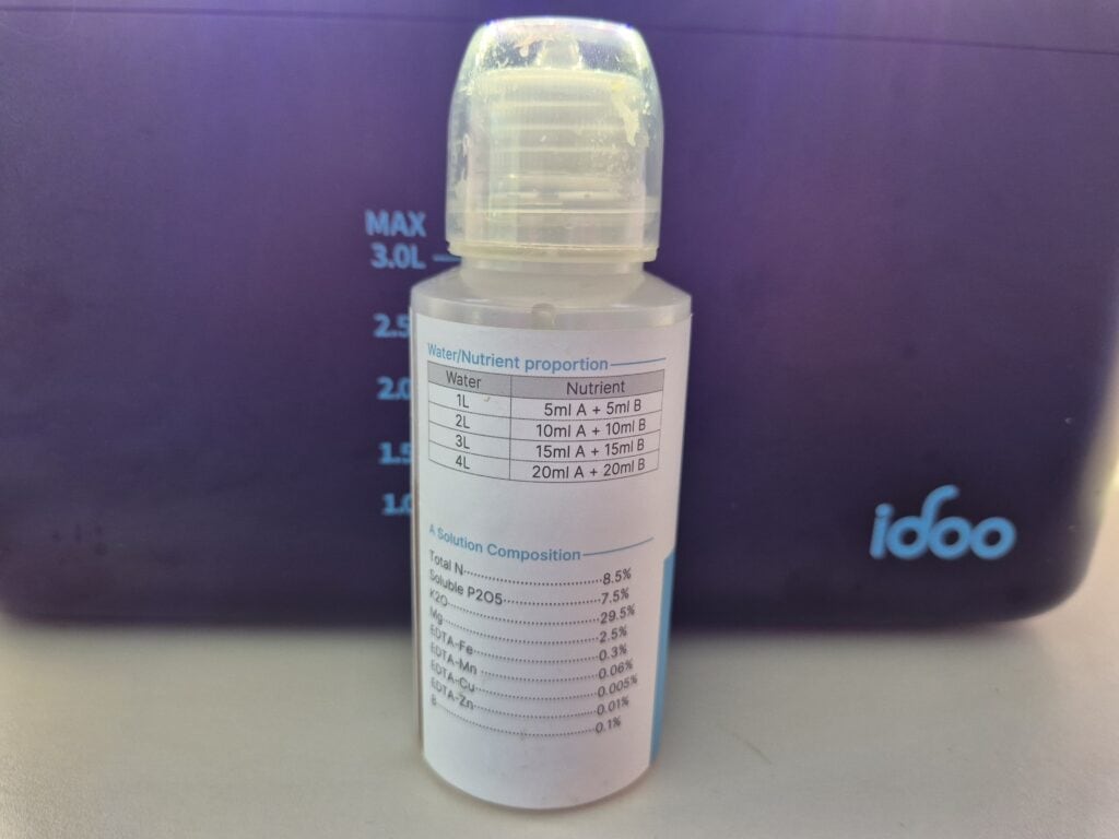 Hydroponic nutrients for beginners showing simple per litre measurements on an iDOO plant food bottle