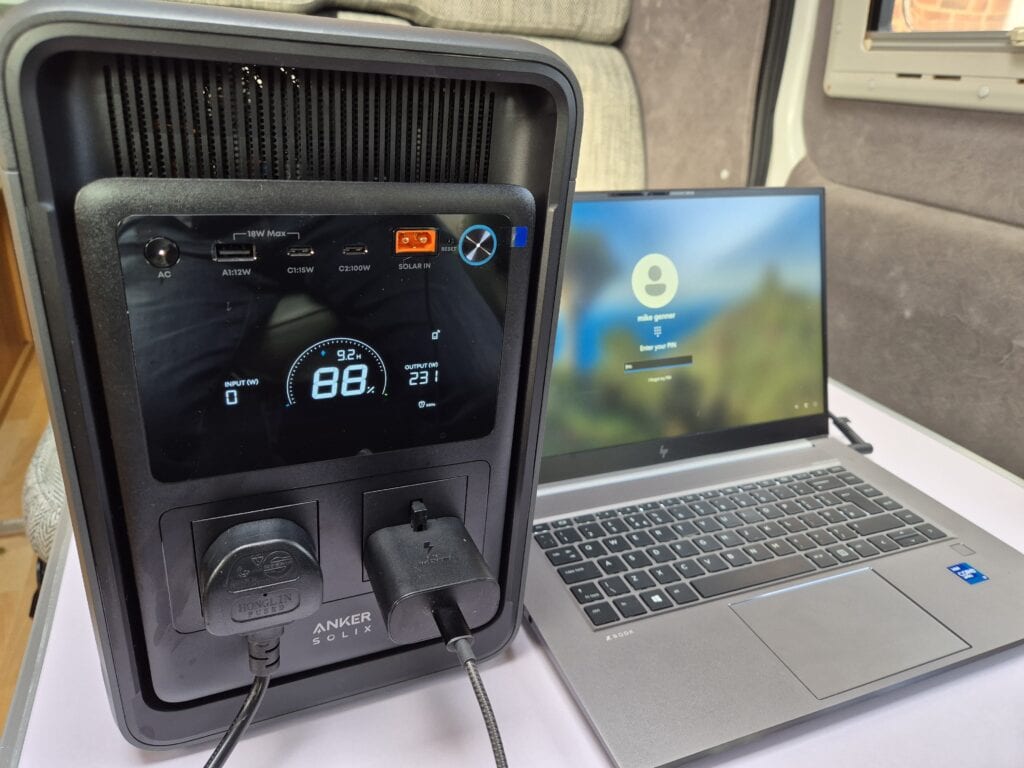 Anker SOLIX S2000 portable power station beside a laptop in my Swift Mondial motorhome