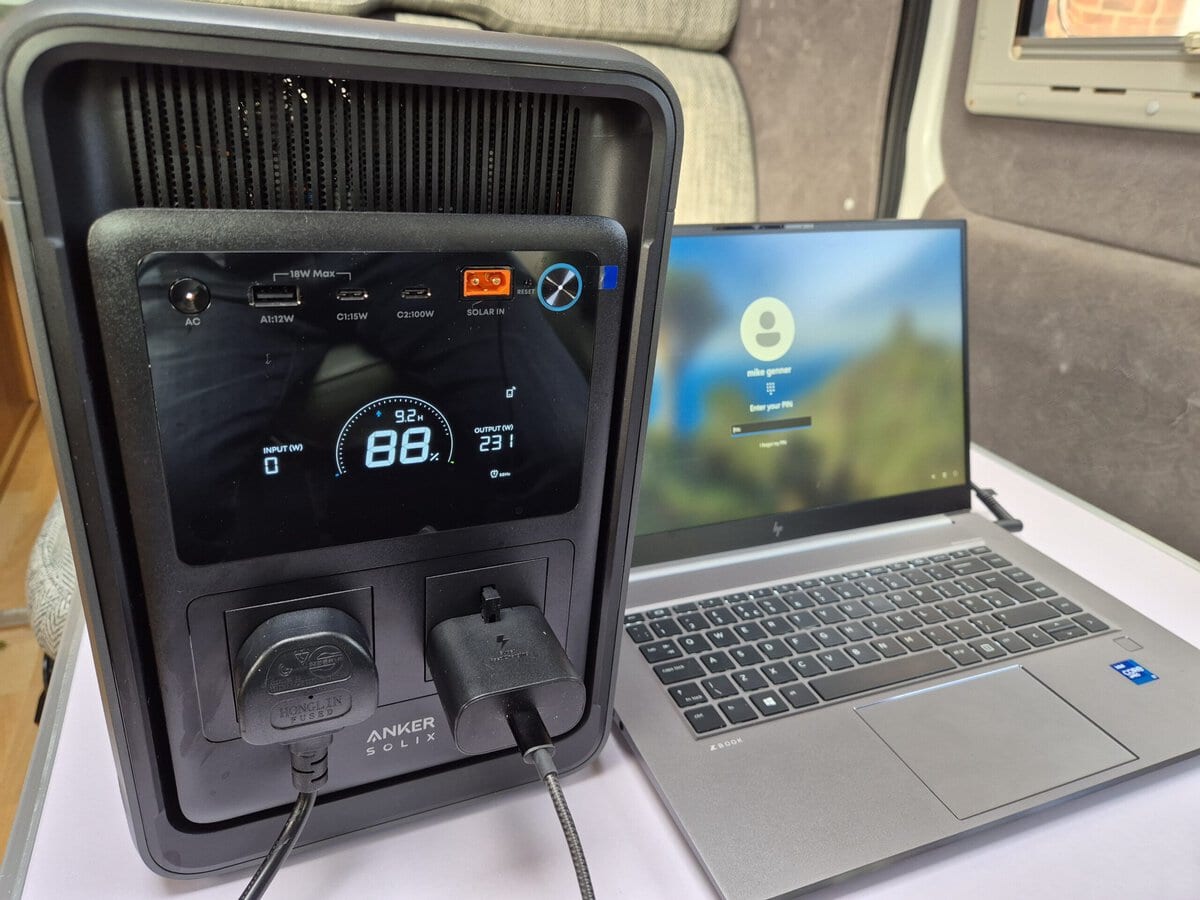 Our Anker SOLIX S2000 power station powering a laptop in a campervan